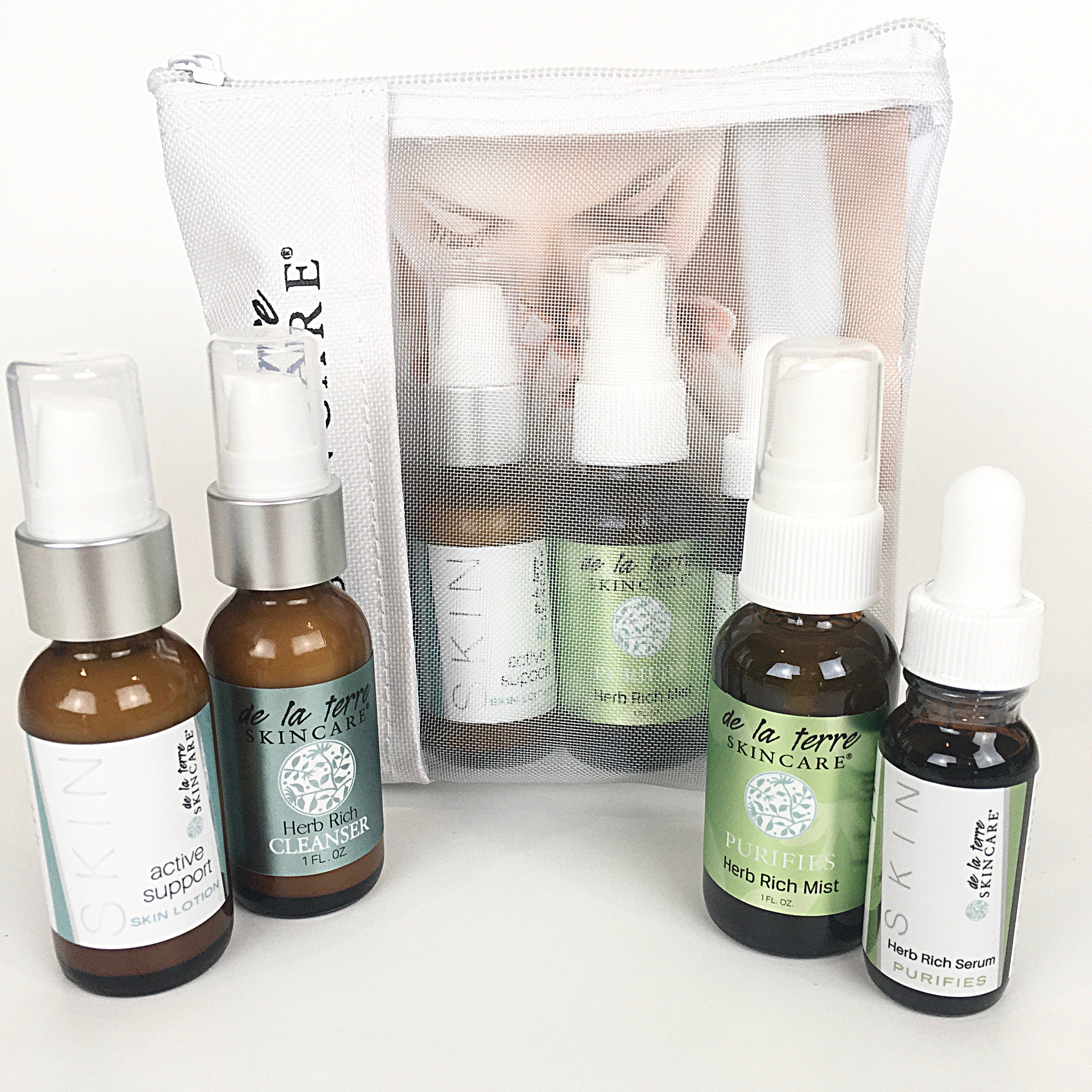 “Purifies Daily Essential Kit featuring three Herb Rich skincare treatments in a breathable De La Terre Skincare travel pouch”