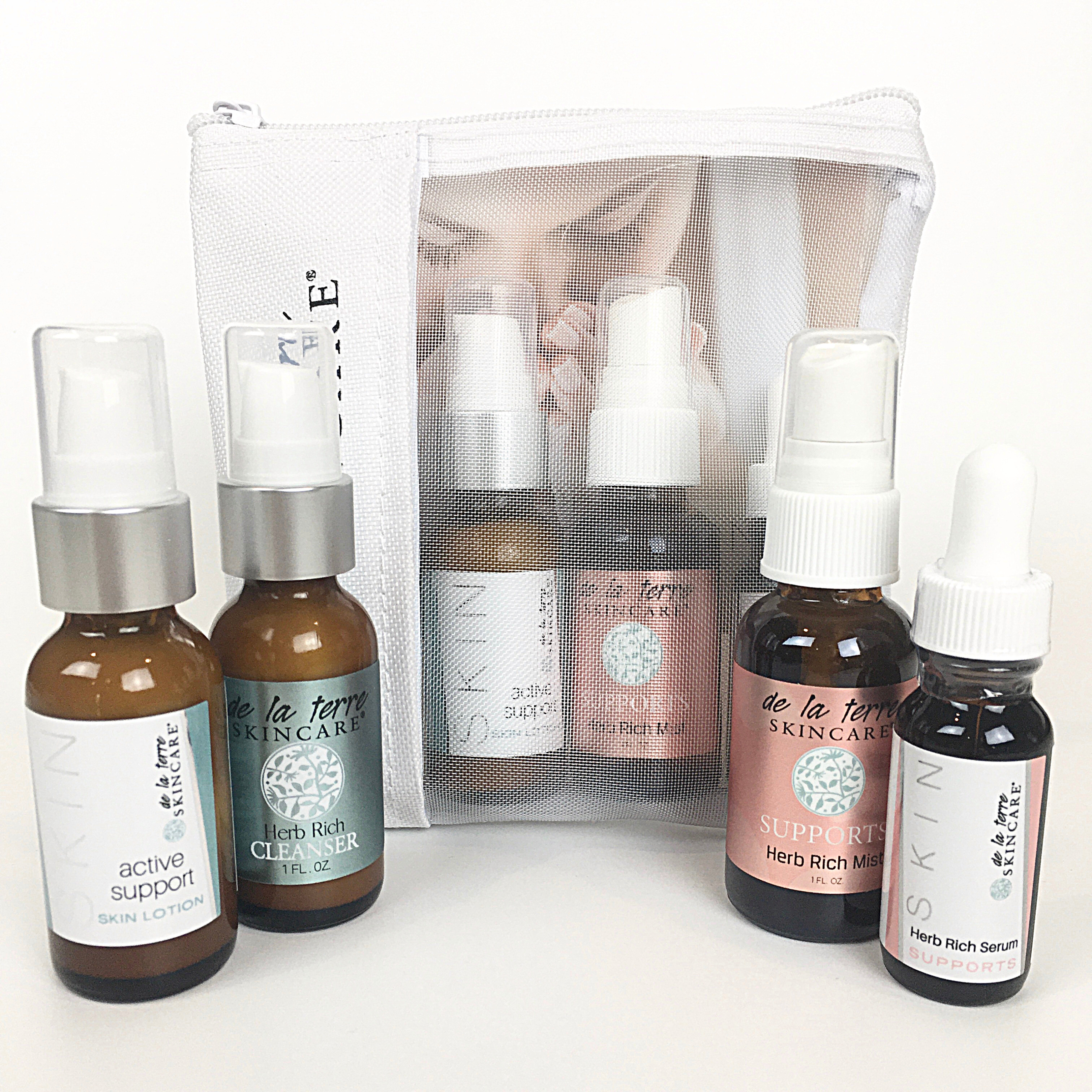 “Supports Daily Essential Kit featuring three Herb Rich skincare treatments in a breathable De La Terre Skincare travel pouch”